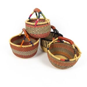 Medium round bolga baskets handmade from elephant grass and leather. Made in Ghana. Perfect for shopping or just sitting pretty.