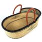 Natural elephant grass Moses basket with tan leather handles.