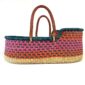 Handcrafted Ghanaian Moses basket made from sustainable elephant grass.
