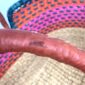 Close up image of leather handle on moses basket.
