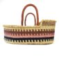 Portable Moses baby basket made from handwoven elephant grass.