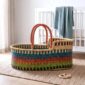 Natural woven Moses basket with a soft, rounded shape.