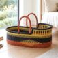 Handcrafted Ghanaian Moses basket with natural woven construction.