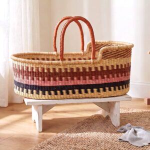 Natural elephant grass Moses basket with sturdy leather handles.