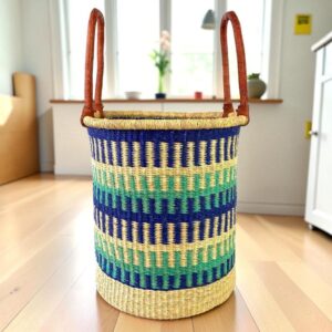 Open laundry basket with a woven pattern and stitched leather handles