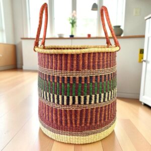 Large laundry basket showing a tight weave pattern with leather handles