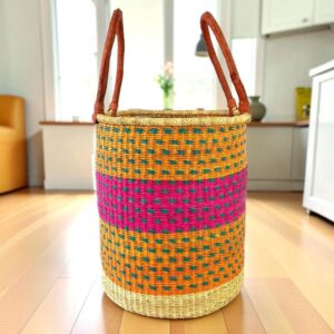 Open weave laundry basket with a patterned design and leather carry handles