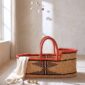 Moses baby basket showing its breathable woven elephant grass sides.