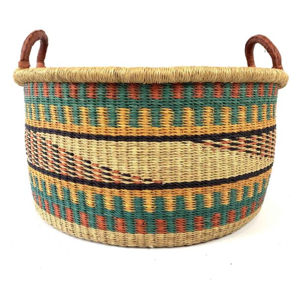 Hamper-basket-181-HoldIt (1) Large elephant grass basket filled with blankets and homewares.