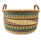 Large elephant grass basket filled with blankets and homewares.