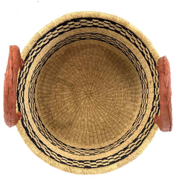 Hamper-basket-185-pronto (2) Large natural basket used for laundry storage in a home.
