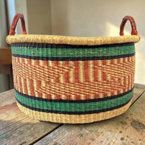 Large natural woven hamper basket with a wide bowl-shaped design.