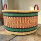 Large natural woven hamper basket with a wide bowl-shaped design.