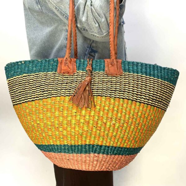 Hand-bag-181-GoldenGate (2) Round Ghana basket with leather handles.