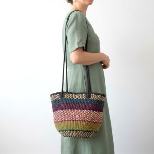 Traditional Ghanaian woven shoulder bag with stripe pattern and leather shoulder straps.