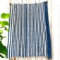 Natural blue cloth with softly shifting dye patterns.