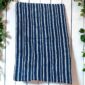 Expertly crafted blue fabric reflecting generational knowledge.
