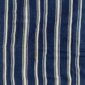 Traditional indigo cloth marked by deliberate, artisanal detail.
