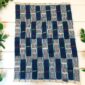 Indigo cloth showing deep woven texture.
