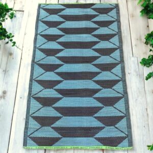 Sustainable woven mat crafted from recycled fibers for floor or wall décor.