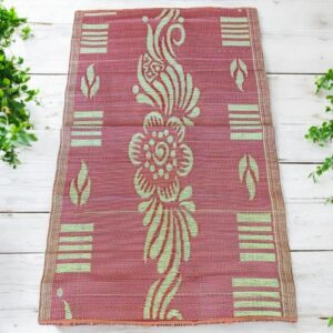 West African mat made from recycled fibers for decorative and practical home use.