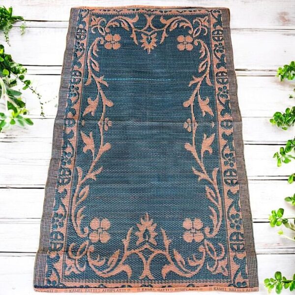 West African handwoven mat crafted from recycled materials for functional décor.