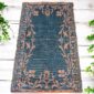 West African handwoven mat crafted from recycled materials for functional décor.