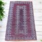 West African woven mat created from recycled materials for mindful home decoration.