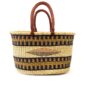 Oval elephant grass basket with sturdy leather carry handles.