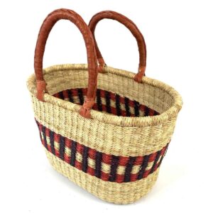 Angled view of the red and purple oval Bolga basket showing the woven interior
