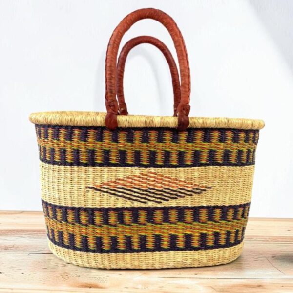 Handwoven Ghanaian basket showing natural variation in colour and pattern.