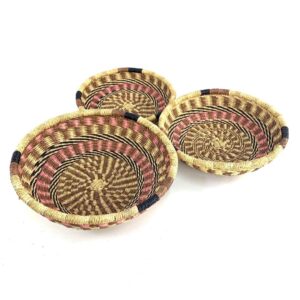 Handmade African Bolga platter set with three woven trays in assorted sizes for versatile everyday use.