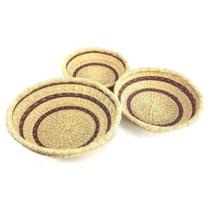 Set of three handwoven Bolga platters handmade in Ghana from natural elephant grass.