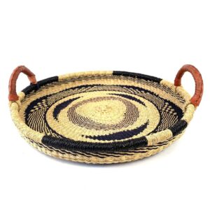 Bolga tray with leather handles, natural and navy swirl pattern, angled view