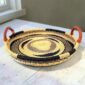 Bolga tray with leather handles styled on a wooden table