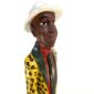Traditional African wood sculpture symbolizing ancestral pride and artisanal storytelling.