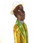 Artisan wooden figure embodying West African tradition and decorative strength.