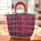 Artisan-crafted Bolga bag combining natural weave strength and contemporary lifestyle appeal.