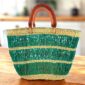 Handcrafted Ghanaian tote offering artisan weave strength and relaxed sophistication.