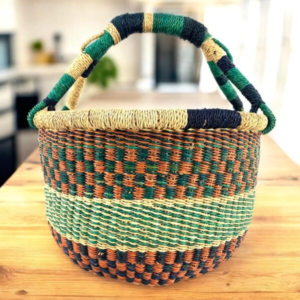 Vegan-Med-round-african-basket-108-pennies (1) Vegan elephant grass basket for magazines, throws, or everyday household items.