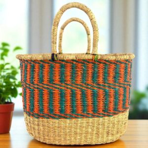 Front view of a handwoven vegan oval Bolga basket made from natural elephant grass, featuring a smooth, leather-free finish.