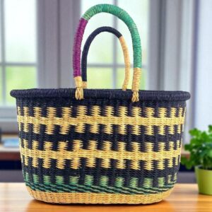 Front view of a handwoven vegan oval Bolga basket made from natural elephant grass, featuring a smooth, leather-free finish.