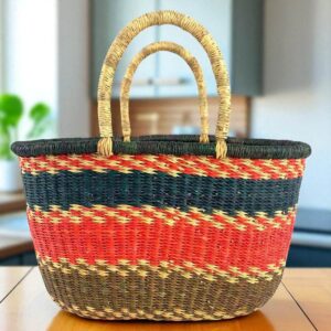 Front view of a handwoven vegan oval Bolga basket made from natural elephant grass, featuring a smooth, leather-free finish.