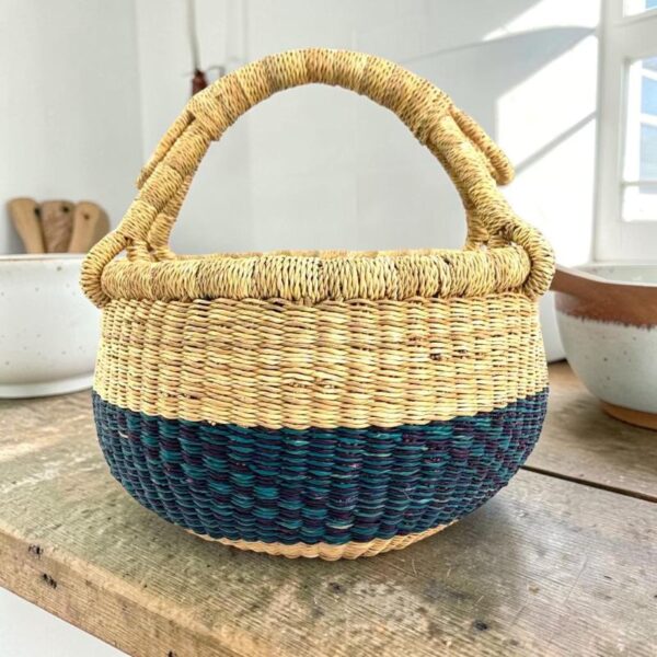 Vegan-small-round-woven-basket-096-BlossumBend (1) Handwoven African Bolga basket offering durable craftsmanship and versatile everyday functionality.