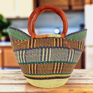Classic market basket with a blocky geometric pattern in earthy tones and leather-wrapped handles