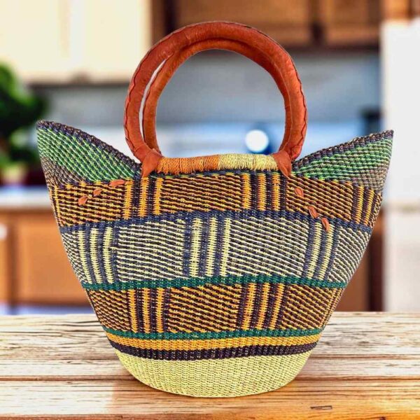 Classic market basket with a blocky geometric pattern in earthy tones and leather-wrapped handles
