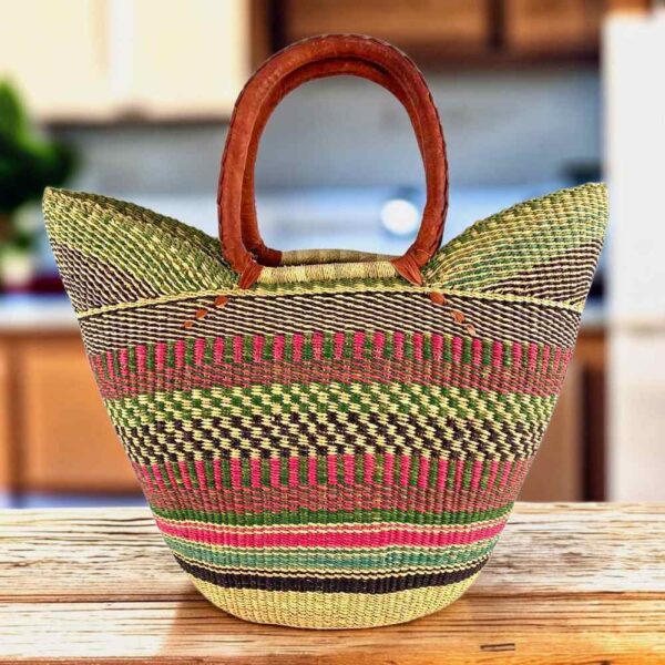 Classic market basket with chequered bands in muted, earthy tones and leather-wrapped handles