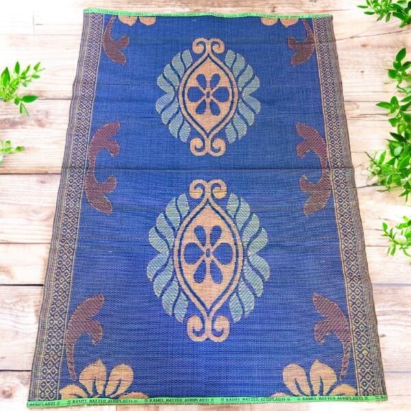 West African woven mat merging recycled artistry with bold, textural presence.
