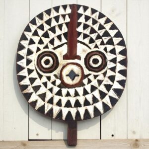 Detailed carving showcasing ancestral symbolism and geometric patterns.