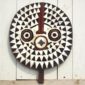 Detailed carving showcasing ancestral symbolism and geometric patterns.